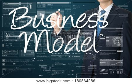 businessman writing Business Model on virtual screen