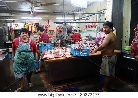 Shopkeepers In A Traditional Butcher Market Stall