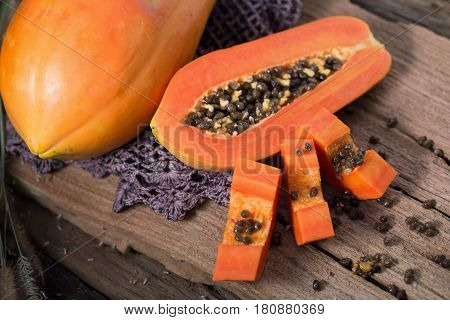 Papaya On Wooden Background. Sliced Of Papaya.