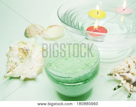 spa lit candles bathing salt sea shells and essences