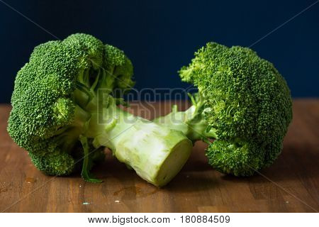 Healthy Green Organic Raw Broccoli Florets Ready for Cooking. Broccoli.Raw fresh broccoli on wooden table.