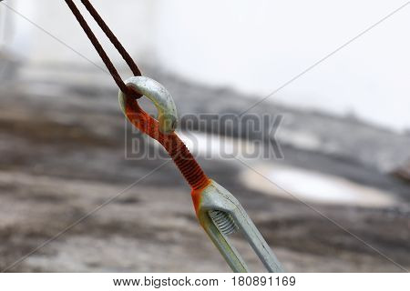 wire rope sling old connection of rusty steel select focus with shallow depth of field.