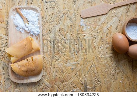 Khanom Tokyo is a thin flat pancake filled with pork or sausage and ingredients. It is a Thai street snack