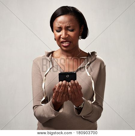 discontented woman with smartphone