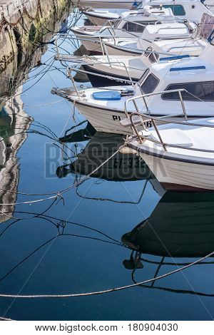 sea port with white boats can be used as background