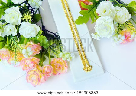 Gold Necklace 96.5 Percent Thai Gold Grade With Gold Hook And Rose Flowers Putting On White Cloth Ba