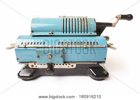 Old blue calculating machine isolated on a white background. Front view.