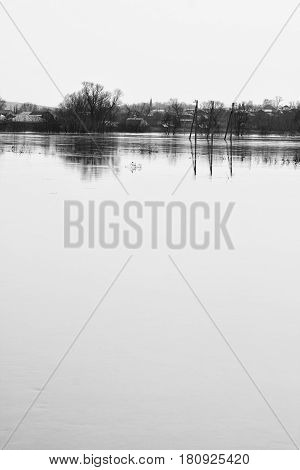 Spring high water in the middle zone of Russia. Black and white landscape.