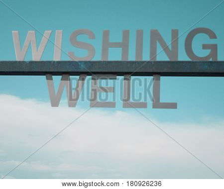 Wishing you well in a cloudy aqua sky