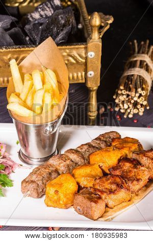 Chicken, the mutton and veal fried on coals is served with ajika and French fries