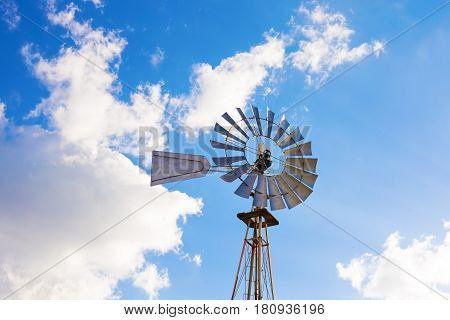 Close-up of a windmil and blue sky.