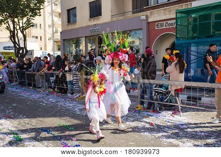 LIMASSOL, CYPRUS - FEBRUARY 26: Grand Carnival Parade - an unidentified people of all ages , gender and nationality in colorful costumes during the street carnival, February 26, 2017 in Limassol, Cyprus.