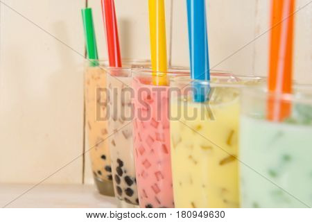 Boba / Bubble tea. Homemade Various Milk Tea with Pearls on wooden table.