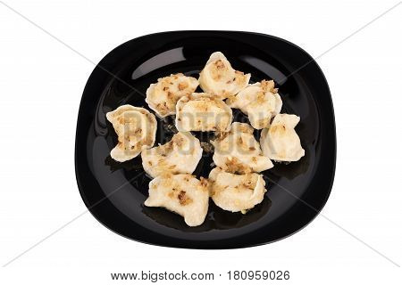 Fresh Dumplings On A Black Plate Seasoned With Crispy Onions. Ukraine