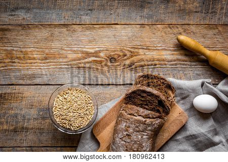 Baking fresh homemade bread on wooden kitchen table background top view moke up