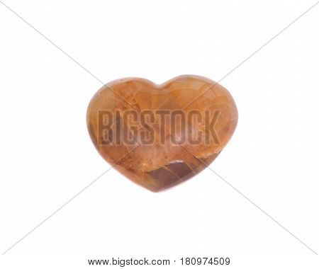 Golden healer quartz heart isolated on white background