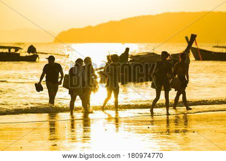 Ao Nang Krabi Thailand - March 03 2017: People on the Ao Nang beach at sunset in Krabi province Thailand