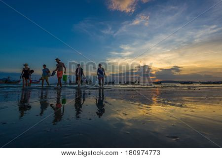 Ao Nang Krabi Thailand - March 02 2017: People on the Ao Nang beach at sunset in Krabi province Thailand