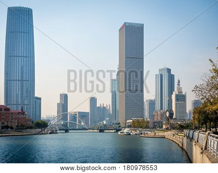 Tianjin, China - Nov 1, 2016: Commercial skyline across the Haihe River. Buildings in modern architectural style.