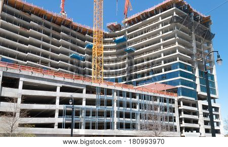 The construction of a skyscraper on a site