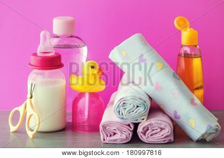 accessories for baby diapers on white background, banny, a bottle of water, cream