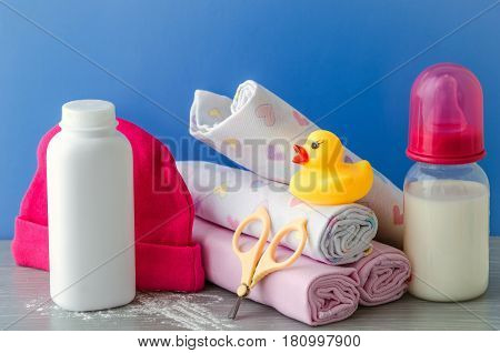 accessories for baby diapers on white background, banny, a bottle of water, cream