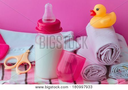 accessories for baby diapers on white background, banny, a bottle of water, cream