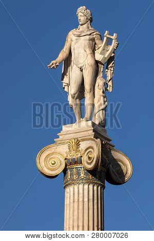 Sunset View Of Statue Of The Ancient Greek God Apollo In Front Of Academy Of Athens, Attica, Greece