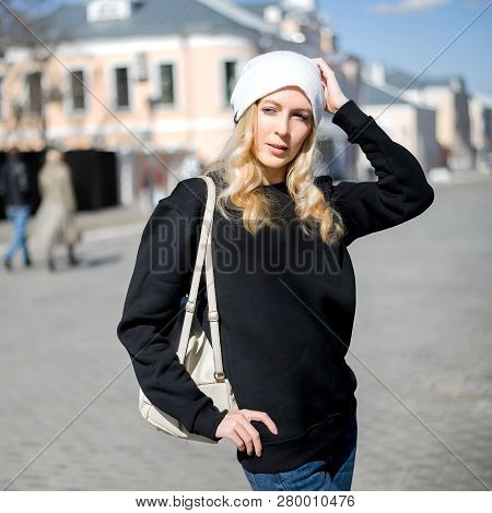 Street Fashion Look. Beautiful Girl In Black Hoody