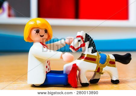 Poznan, Poland - January 20, 2019: Playmobil Woman Figure Playing With A Small Wooden Horse In Soft 