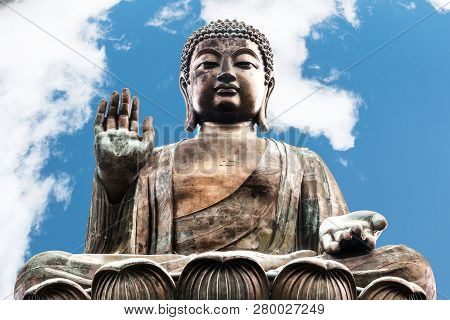 Buddha Image In Polin Temple In Hong Kong With Blue Sky