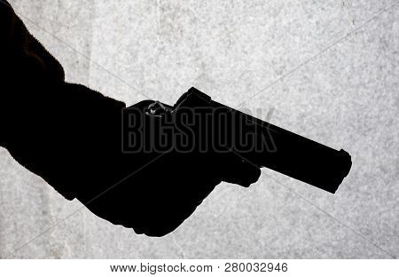 The Gun In The Hand Of Men Who Is Ready To Shoot At His Victim. Breaking The Law And Crime. Attack W