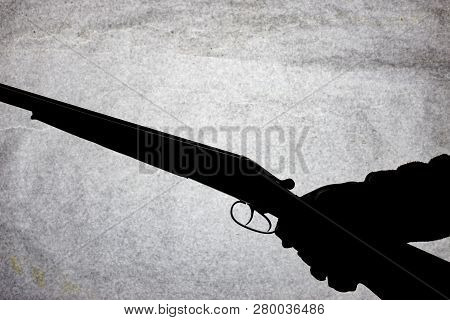 Classic Double-barrell Smooth-bore Hunting Rifle On Man Hand Isolated On Light Stone Background