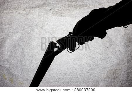 Classic Double-barrell Smooth-bore Hunting Rifle On Man Hand Isolated On Light Stone Background