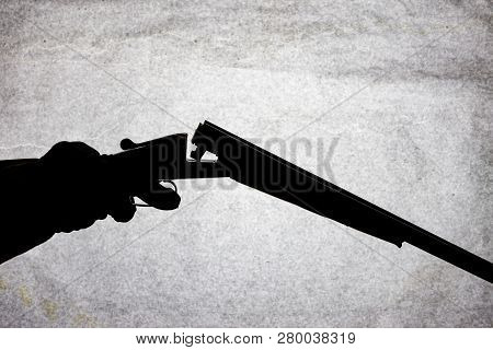 Classic Double-barrell Smooth-bore Hunting Rifle On Man Hand Isolated On Light Stone Background