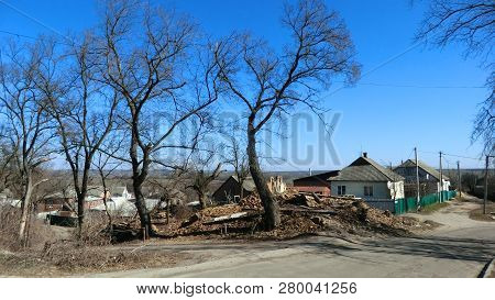 Spring Street Landscape Of Ukrainian Small Town Hadyach Poltava Region With Trees And Ruins