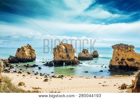 Rocks In Blue Ocean In Sunny Day, Algrave, Portugal