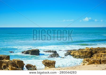 Rocks In Blue Ocean In Sunny Day, Algrave, Portugal