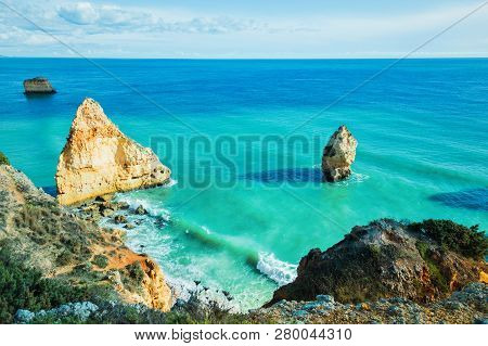 Amazing Rocks In Blue Ocean. Marinha Beach, Algrave, Portugal