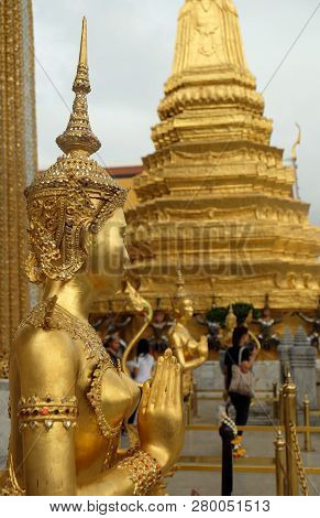Golden Kinnari Statue At Temple Of Emerald Buddha (wat Phra Kaew) In Grand Royal Palace. Half-bird,