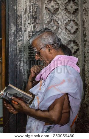 Belur, Karnataka, India - November 2, 2013: Chennakeshava Temple. Male Devotee In Front Of Devi Rang