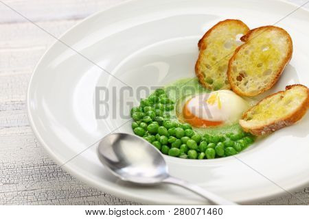 tear peas with poached egg, spanish basque cuisine