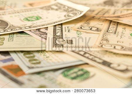 Abstract Background Of Various Dollar Bills. Selective Focus