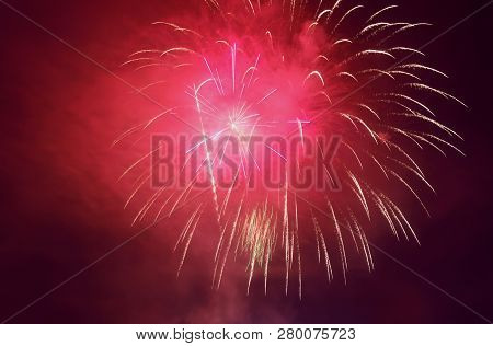 Red Fireworks Display In Night Skiy With Red Smoke
