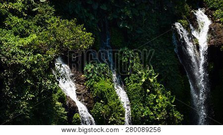 Waterfall Coban Sewu In Java, Indonesia. Waterfall In Tropical Forest By Drone Tumpak Sewu