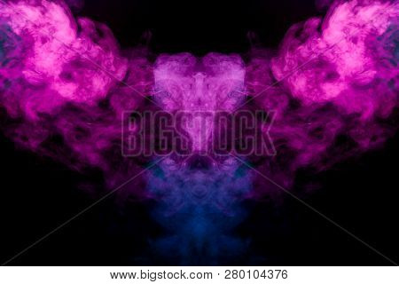 Thick Colorful Smoke Of Blue, Pink And Red  In The Form Of A Skull, Monster, Dragon On A Black Isola