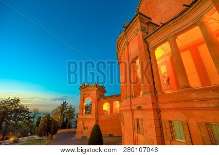 Side View Of Sanctuary Of Madonna Di San Luca And Arcades Of Its Long Portico With Light Of Evening.
