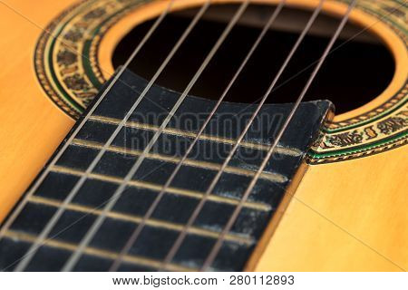 Closeup Wooden Classical Guitar. Old Classical Guitar With Nylon Strings. Old Acoustic Guitar