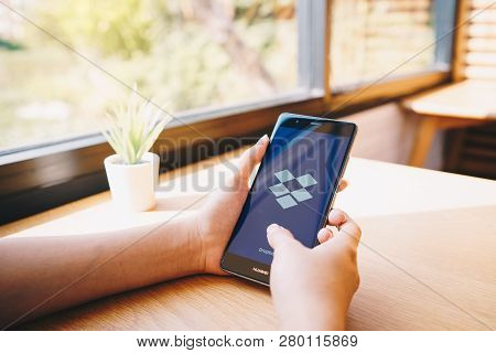 Chiang Mai, Thailand - Jan. 19,2019: Woman Holding Huawei With Dropbox On Screen. Dropbox Is A Servi