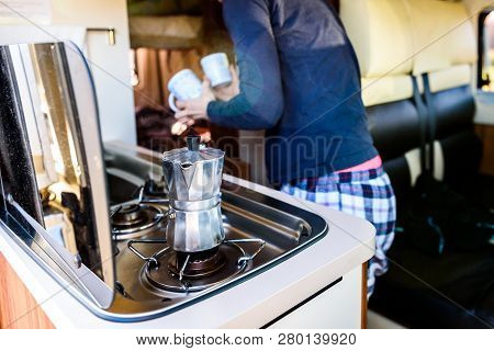 Cooking Coffee In Campervan, Caravan Or Rv On Camping Trip.